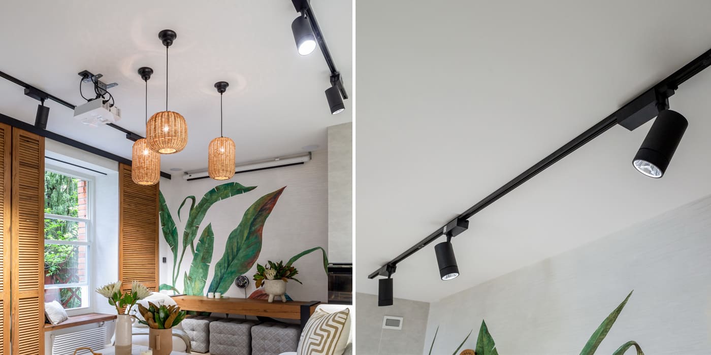 Трековые светильники в гостиной можно смонтировать на любой потолок